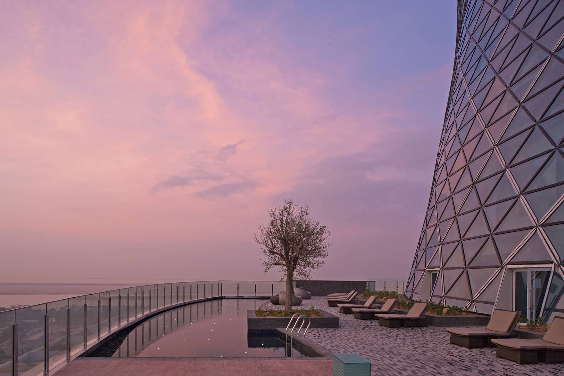 Architecture Photography: A serene pool deck at dawn: Andaz Hotel, Capital Gate Building, Abu Dhabi.